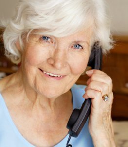 woman using land line phone